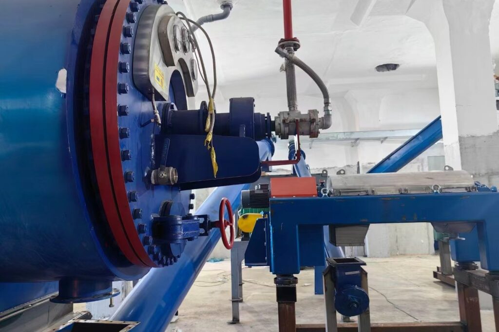 Close-up of a vessel end flange, sight glass and instrumentation on a process unit