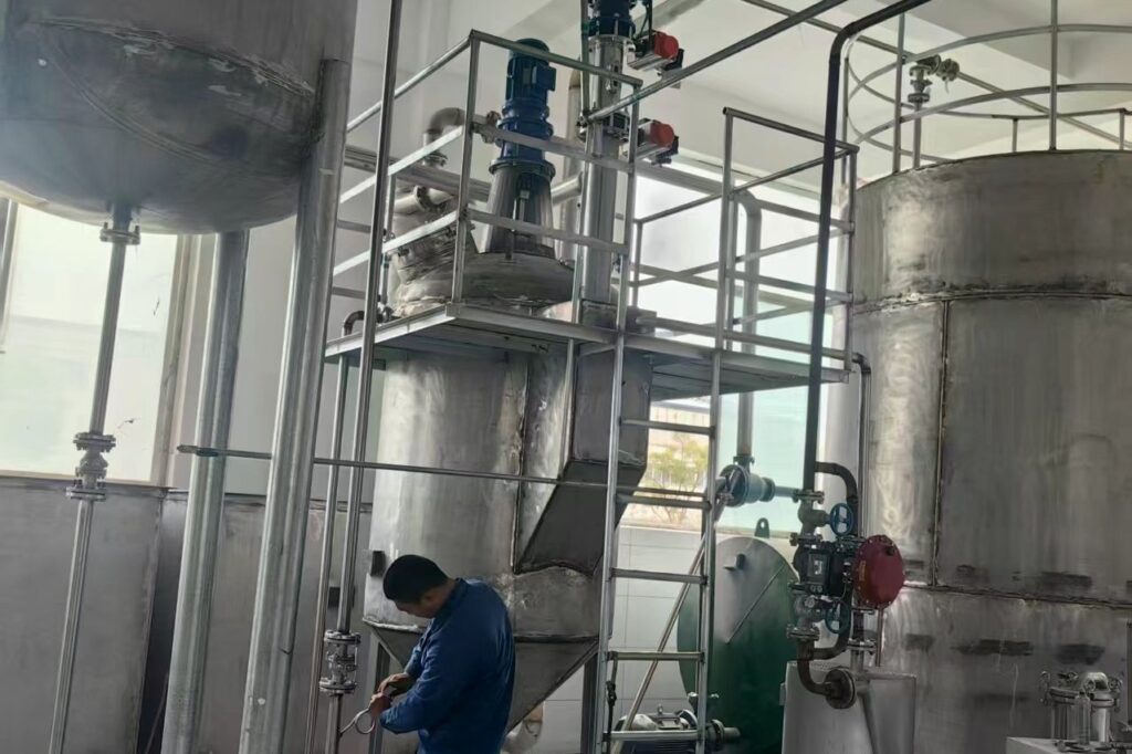 Stainless steel tank, pump and piping during site installation
