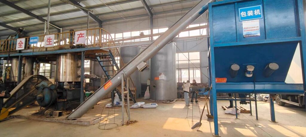 Packing machine and screw conveyor installed in a processing workshop