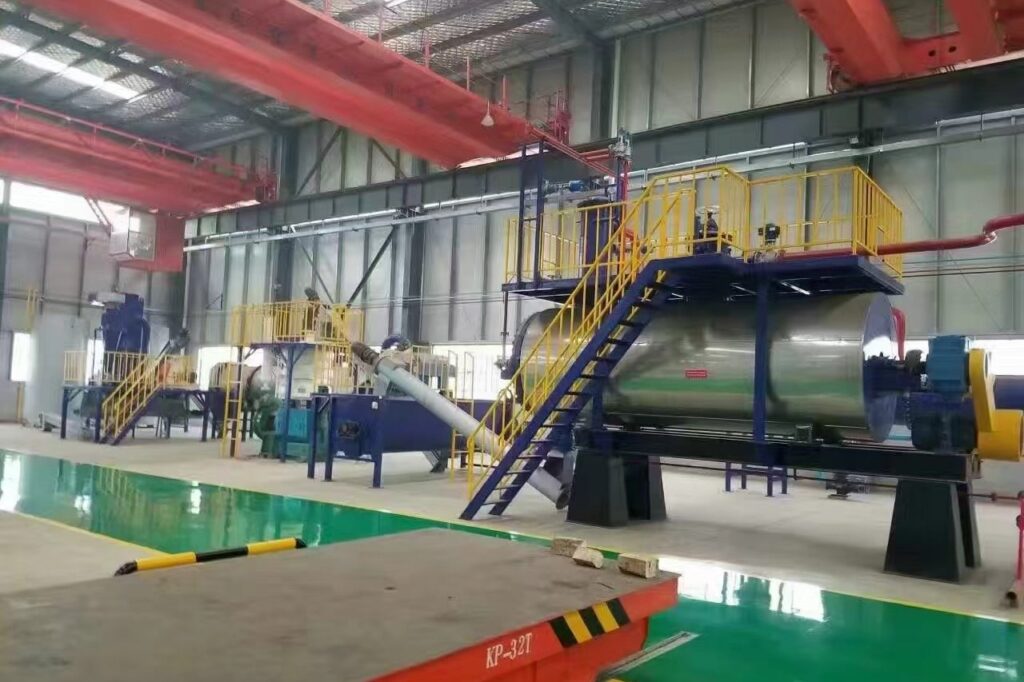 Workshop panorama with overhead crane, stainless steel cooker and transfer cart