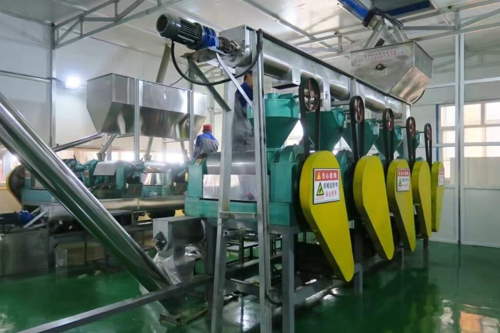 Screw press line with drive guards and feeding conveyor